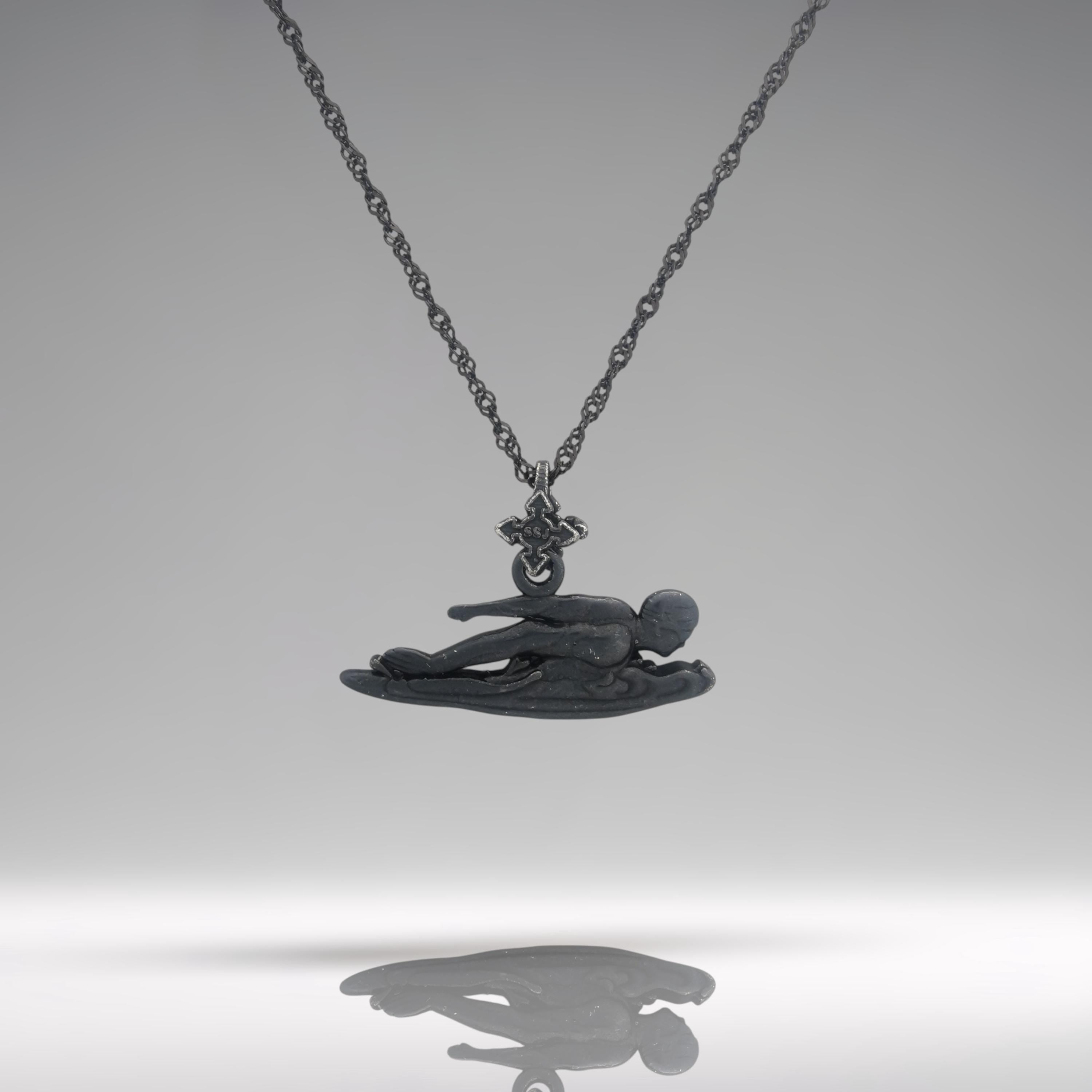 Freestyle swimming necklace crafted in oxidized black 925 sterling silver — a bold and dynamic pendant honoring speed, strength, and aquatic motion.
This handcrafted piece captures a male swimmer mid-stroke in a freestyle pose, with sleek lines that evoke precision and control in the water. The matte black finish adds modern edge and intensity, making it a meaningful piece for professional swimmers, fans of water sports, or anyone who lives with power and purpose.