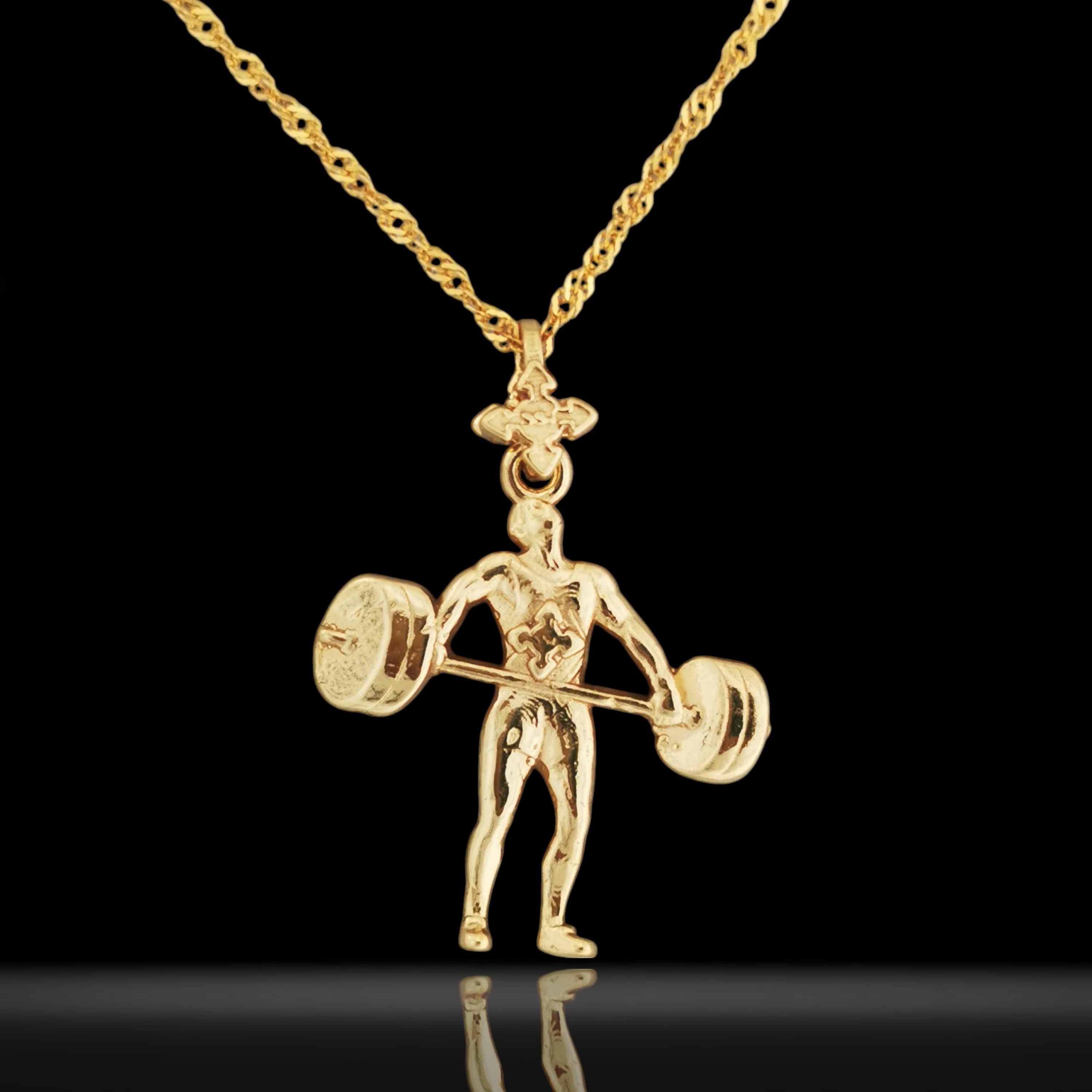 Gold-plated weightlifting necklace in 925 sterling silver – bold gym pendant made for strong-willed men who lift with passion. Designed for bodybuilders, coaches, and disciplined athletes, this piece combines elegance with raw power.
The handcrafted figure shows a male lifter mid-movement with a detailed barbell – a tribute to strength, endurance, and fitness goals. The rich gold-plated finish adds a modern yet classic edge, perfect for gifting or daily wear.