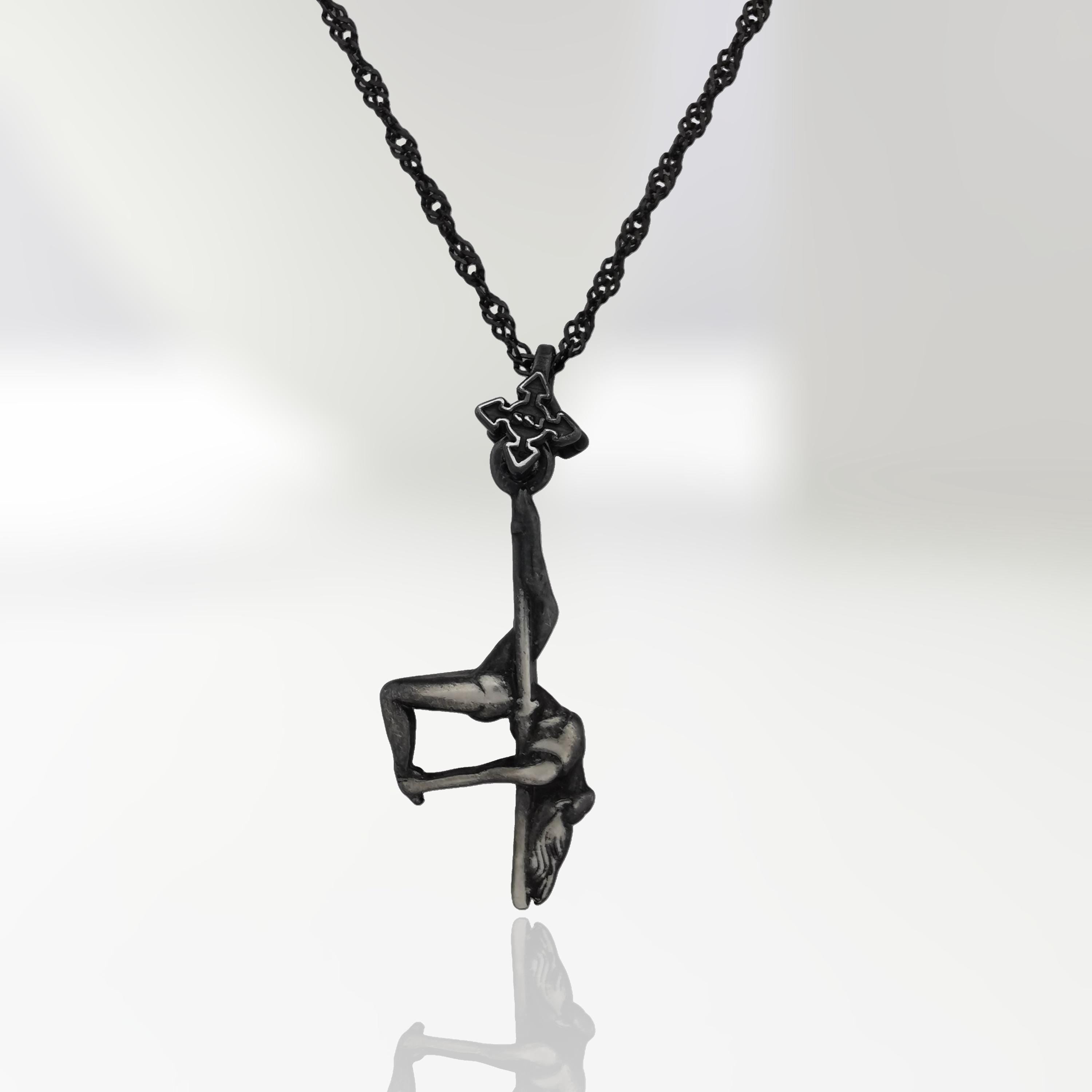 Vintage-style pole dance necklace in patinated 925 sterling silver — a timeless tribute to sensuality, grace, and the art of movement.
This handcrafted piece features a female pole dancer suspended mid-pose, captured in an expressive inverted form. The antique finish adds depth and character, enhancing every curve with classic elegance and bold artistry. A pendant for women who move with passion and leave a lasting impression.