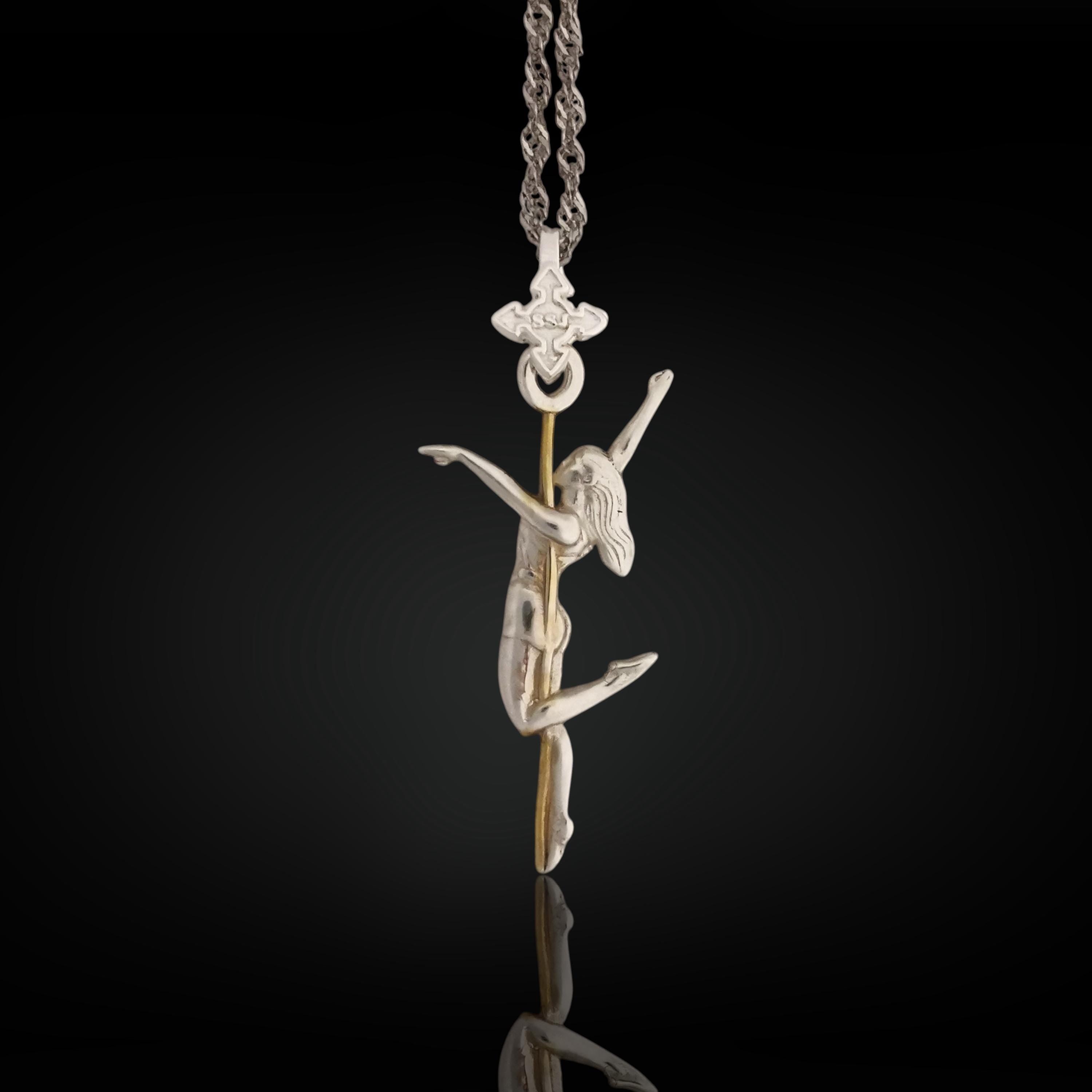 Two-tone pole dance necklace crafted in solid 925 sterling silver with elegant gold plating – a refined and sensual pendant celebrating the beauty of feminine movement.
The design features a graceful woman wrapped around the pole in an expressive pose. The silver-and-gold contrast highlights the curves, energy, and elegance of the performance. A tribute to confidence, desire, and the freedom of self-expression – whether on stage or in life.