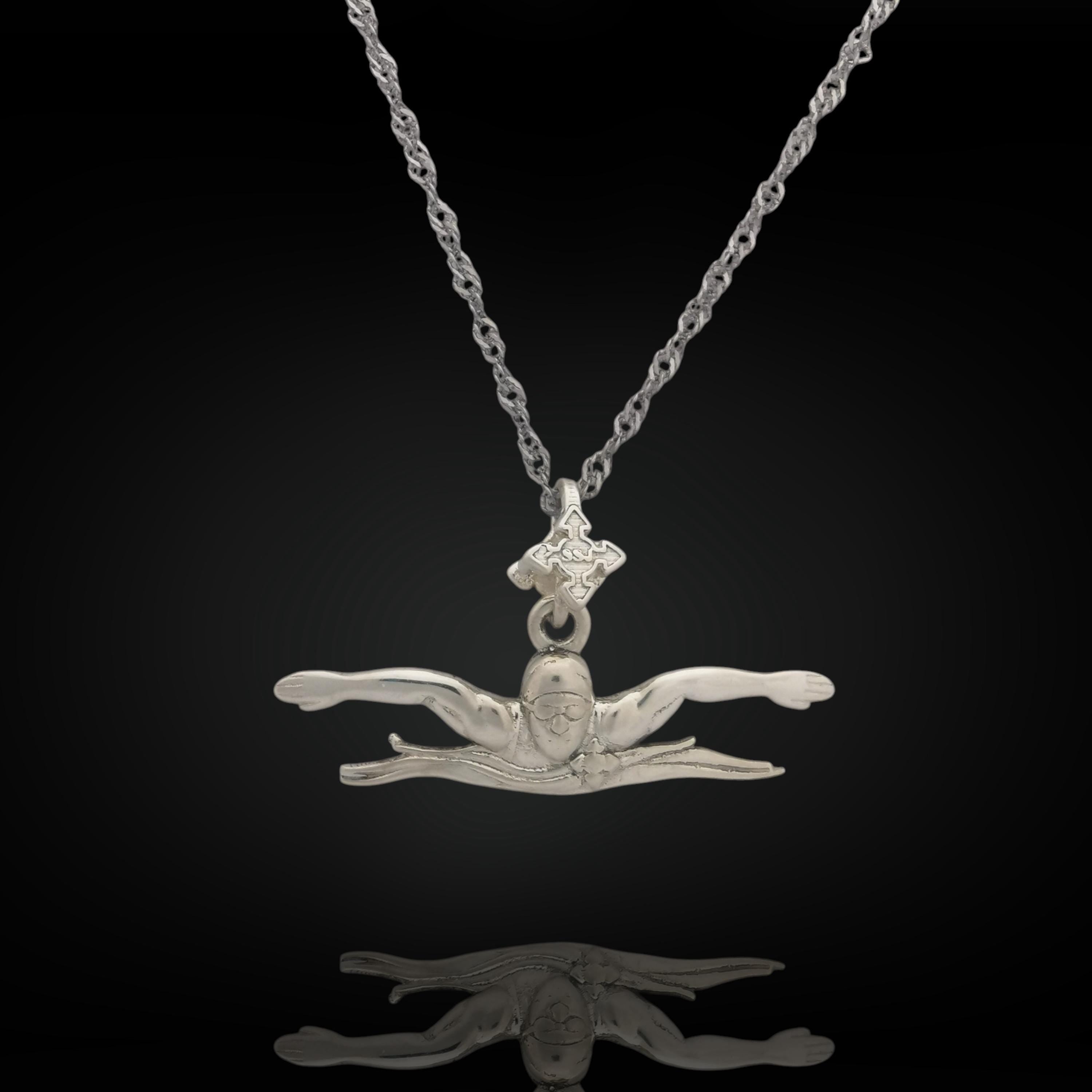 Butterfly swim necklace crafted from solid 925 sterling silver — a sleek pendant capturing the power and focus of the butterfly stroke. Handcrafted for men and teen boys, it's a meaningful gift for swimmers of all levels.
📏 Details:
• Height: 12 mm (0.47 in)
• Width: 35 mm (1.38 in)
• Weight: 2.26 grams