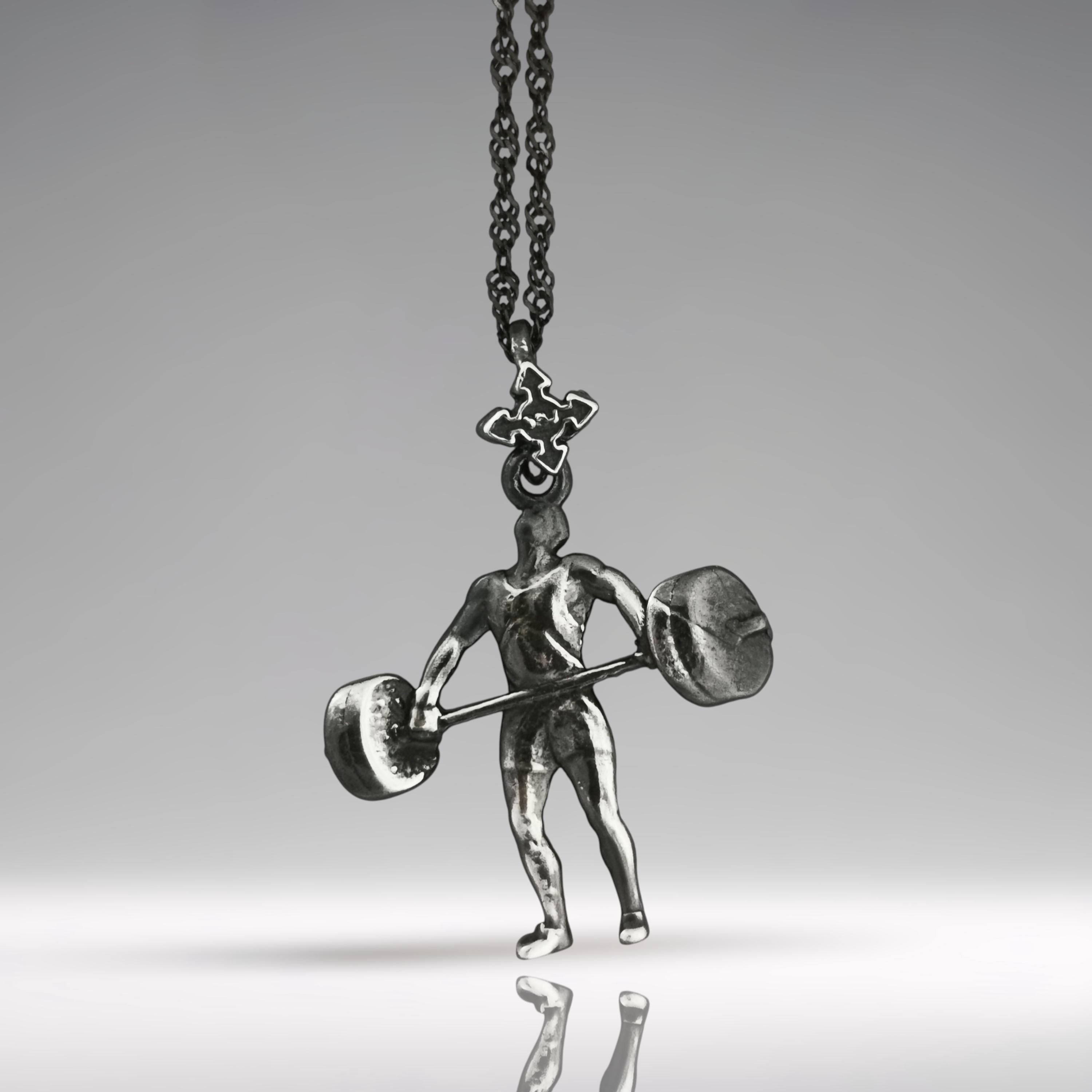 Vintage style weightlifting necklace in solid 925 silver – designed for men who live with strength and purpose. This handcrafted pendant captures the essence of classic gym culture and timeless athleticism.
With its vintage finish and detailed weightlifter form, it's made for those who appreciate raw effort, discipline, and physical mastery. A meaningful gift for power athletes and fitness mentors.