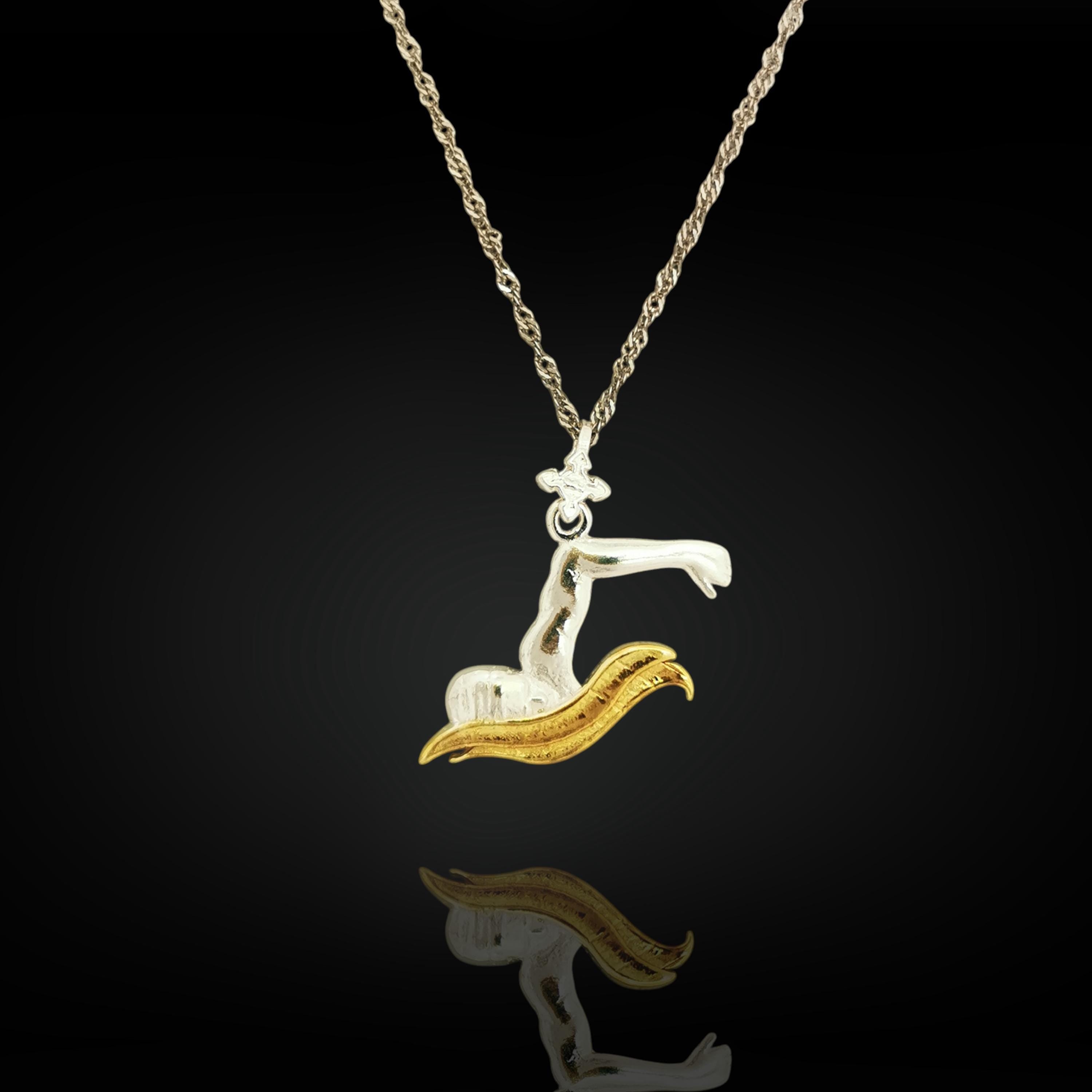 Two-tone swimmer pendant in solid 925 sterling silver with partial gold plating — a standout piece for men and teen boys who live to perform in the pool.
The pendant features a swimmer mid-breaststroke, combining clean silver lines with subtle gold detail for contrast and style. Designed for boys and men who pursue strength, discipline, and self-mastery. A unique gift for team members, coaches, or personal milestones in training and competition.